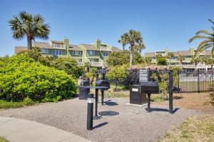 a bunch of parking meters in front of a building at 3C Mariners Walk by AvantStay Beach Pool Access Enclosed Porch in Isle of Palms