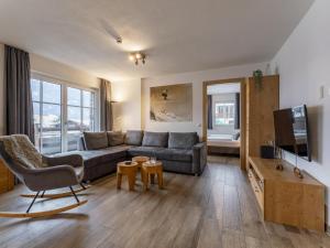 Televízia a/alebo spoločenská miestnosť v ubytovaní Luxury Tauern Suite Walchen Kaprun 1