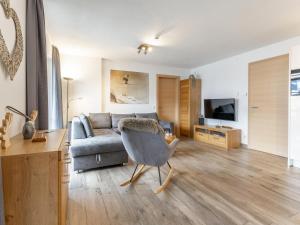 Televízia a/alebo spoločenská miestnosť v ubytovaní Luxury Tauern Suite Walchen Kaprun 1