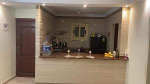 a kitchen with a counter with some fruit on it at Rental Apartment Sea View in Alexandria