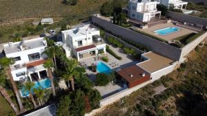 an aerial view of a house with a swimming pool at Villa Chrysa Rhodes in Afantou