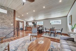 a living room with a couch and a table at Comfortable home near wineries and hiking farmhouse in Hendersonville