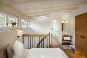Un pat sau paturi într-o cameră la Pension Riedingerhof