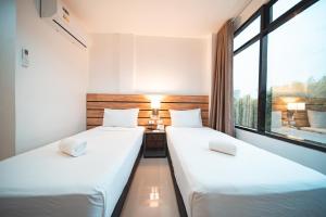 Postel nebo postele na pokoji v ubytování Travelbee Minglanilla Inn