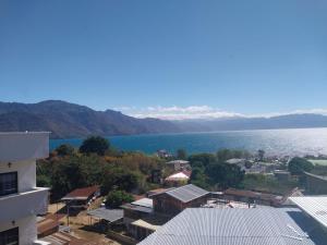 a view of the water from a building at Apartamento Kassona in San Pedro La Laguna