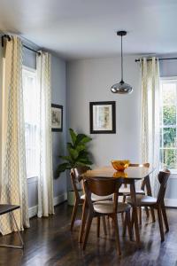a dining room with a table and chairs at Modern, Pet-Friendly Retreat, Named Best BnB in Bham in Birmingham