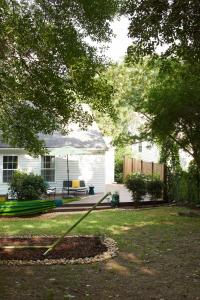a yard with a lawn mower in front of a house at Modern, Pet-Friendly Retreat, Named Best BnB in Bham in Birmingham