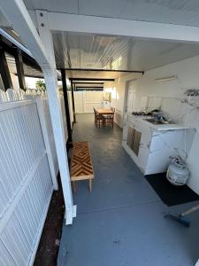 an empty garage with a kitchen and a table at Adrien Guest Studio in Miami Gardens