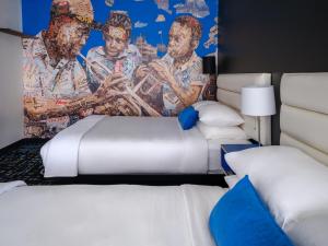 Postel nebo postele na pokoji v ubytování Jupiter Hotel