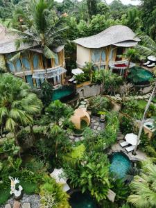 an aerial view of a resort with a swimming pool at The Udaya Resorts and Spa in Ubud