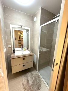 a bathroom with a shower and a sink and a mirror at Luxury House Porte VERSAILLES Eiffel in Paris