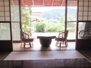 a room with a table and two chairs and a window at Kyoto - House / Vacation STAY 14527 in Kyoto