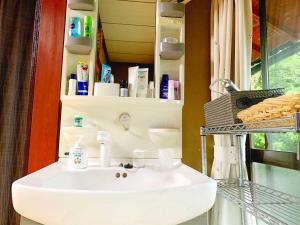 a bathroom with a white sink and a mirror at Kyoto - House / Vacation STAY 14527 in Kyoto