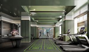 a fitness room with a gym with exercise equipment at Regent Shanghai on the Bund in Shanghai