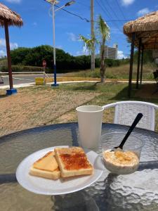 a plate with two slices of bread on a table at YAJASU STAY Saipan in Saipan