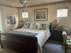 a bedroom with a bed and a ceiling fan at Her Castle Bed and Breakfast in Cambria