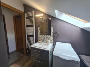 a small bathroom with a sink and a mirror at Charmante maison avec jardin, au cœur du Berry, proche rivière et randonnées - FR-1-591-57 in Chasseneuil +20 photos