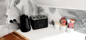 a black appliance sitting on a counter in a room at NYC Loft Brisbane in Brisbane