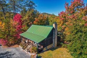 an overhead view of a cabin with a green roof at Dreamside Peak in Pigeon Forge