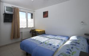 Postel nebo postele na pokoji v ubytování Hôtel-Gîte rural à 3 km de Delémont