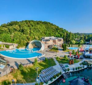 an aerial view of a resort with two swimming pools at Tóparti Kuckó in Mályi
