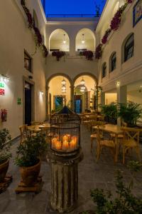 a restaurant with a cage with candles in it at Palpatio Hotel in Guadalajara