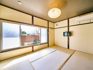 Postel nebo postele na pokoji v ubytování Kokoyui Guesthouse Shingu + 37 fotografií