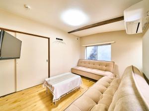 TV a/nebo společenská místnost v ubytování Kokoyui Guesthouse Shingu
