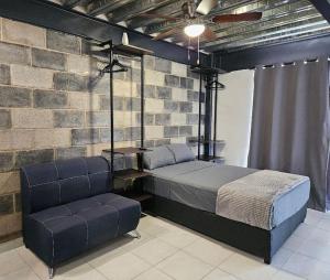 Una cama o camas en una habitación de Depas MiniLoft
