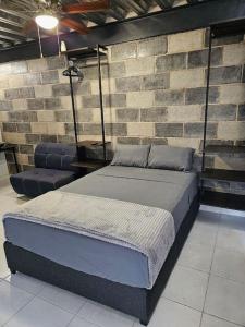 Una cama o camas en una habitación de Depas MiniLoft