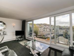 a living room with a view of a city at The Heights in Bowness-on-Windermere