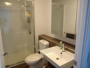 a bathroom with a toilet and a sink and a shower at L39 1Min to SouthernCross,free Gym, Pool, sunna,Tram ,Sauna in Melbourne +85 photos