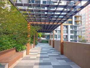 a pergola over a walkway in a building at L39 1Min to SouthernCross,free Gym, Pool, sunna,Tram ,Sauna in Melbourne
