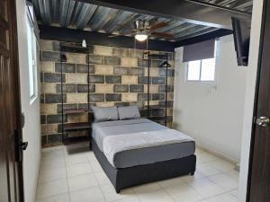 Una cama o camas en una habitación de Depas MiniLoft