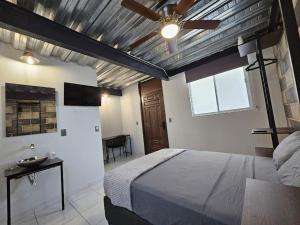 Una cama o camas en una habitación de Depas MiniLoft