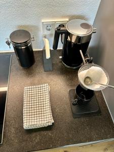 a kitchen counter with two pots and pans on it at Wolfgangsee Seeblickplatzl in Strobl