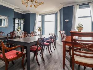 a dining room with a table and chairs at Eden Bay Retreat in Morecambe