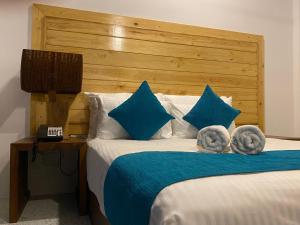 Ένα ή περισσότερα κρεβάτια σε δωμάτιο στο Trinco Beach Resort