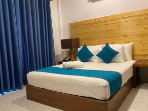 Ένα ή περισσότερα κρεβάτια σε δωμάτιο στο Trinco Beach Resort