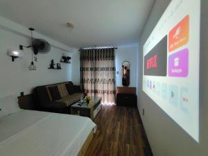 a small room with a bed and a couch at Căn hộ Studio-Banana Homestay in Hue