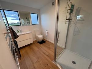 a bathroom with a shower and a toilet at Countryside peace and comfort , in Cambridge