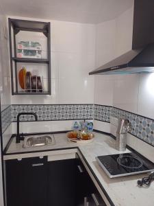 a kitchen with a sink and a counter top at La viña de camarata in Aguilar de la Frontera