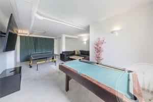 a living room with a pool table in it at La Manga Club - Monte Claro 606 in Atamaría