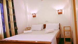 Postel nebo postele na pokoji v ubytování Sweden Inn Guesthouse