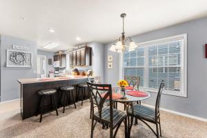 a kitchen and dining room with a table and chairs at Par View Vista Condo in Branson West