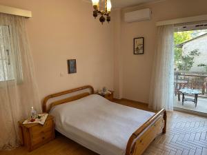 Ένα ή περισσότερα κρεβάτια σε δωμάτιο στο Seashell Home
