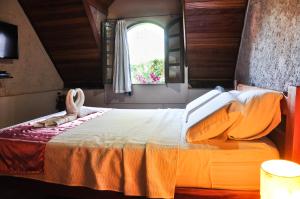 Cama ou camas em um quarto em Castelar da Alvorada