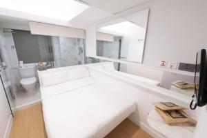 Tempat tidur dalam kamar di Mini Central