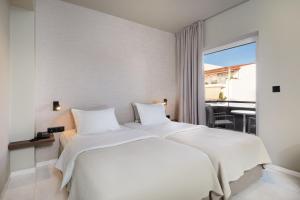 Postelja oz. postelje v sobi nastanitve Hotel Nafpaktos