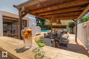 a vase with fruit in it sitting on a wooden table at Villa Yelir by Abahana Villas in Calpe